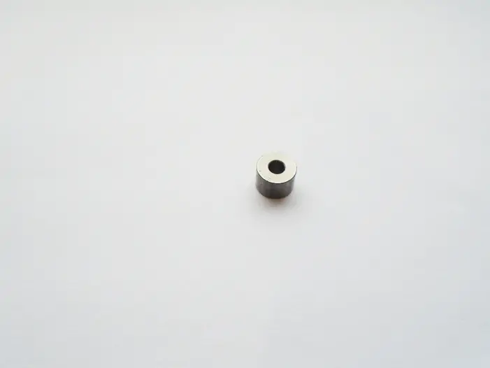 Spacer for hinge screw